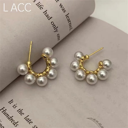 women C-shaped pearl Stud Design s925 Silver Pin earrings light luxury earrings.