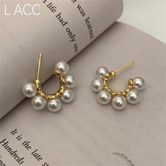 women C-shaped pearl Stud Design s925 Silver Pin earrings light luxury earrings.