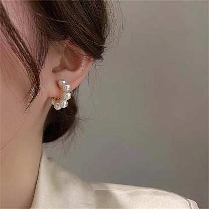 women C-shaped pearl Stud Design s925 Silver Pin earrings light luxury earrings.