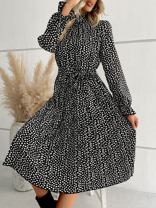 Elegant women's high collar polka dot dress with waist tie, perfect for a chic and stylish look. This trendy outfit is designed for fashion-conscious women seeking a sophisticated, contemporary wardrobe choice.